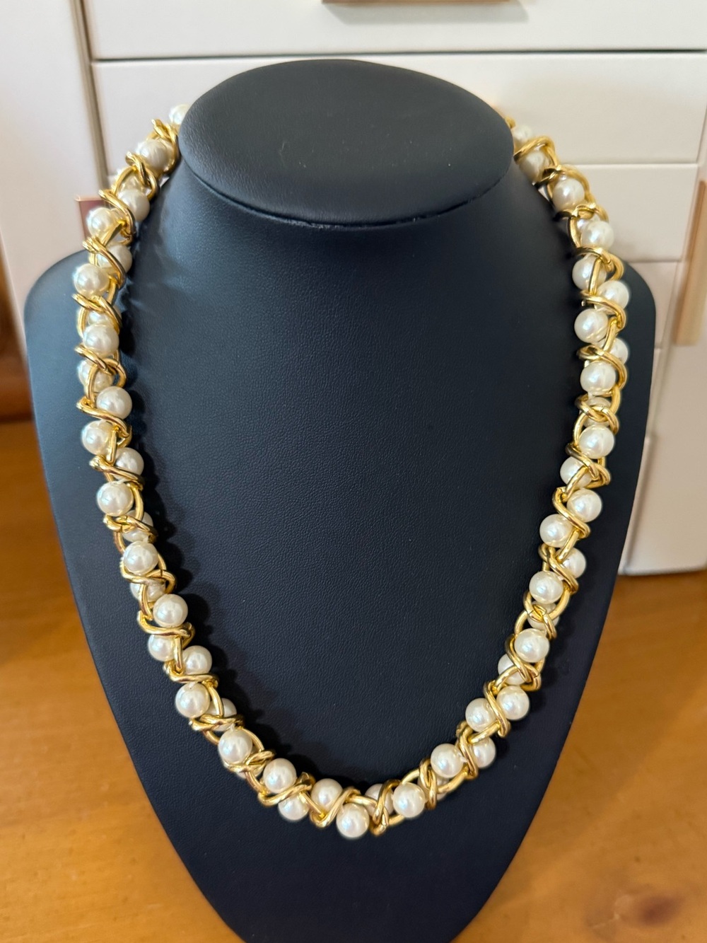 Gold tone and pearl braided necklace